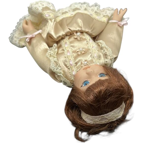 Porcelain Girl Doll in Champagne Satin Dress with Auburn Hair - Picture 8 of 11